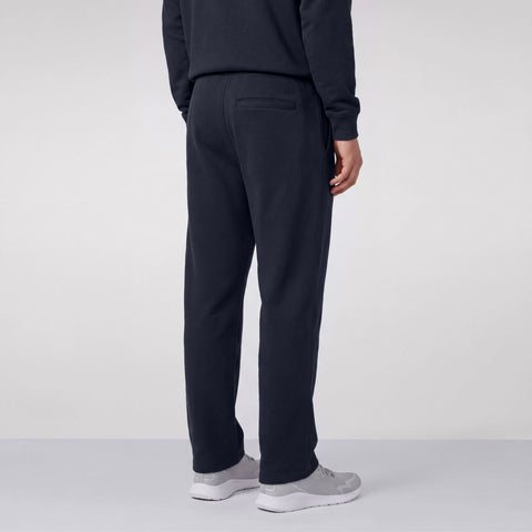 Midnight navy sweatpants shown from the back, with a welt back pocket.