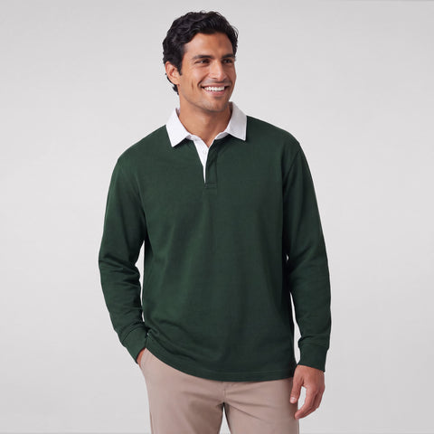 A dark green rugby polo with a white collar, shown on a plain background.