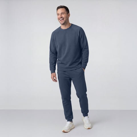 Man modeling the Sandwash Crewneck in Tidal Blue from the side