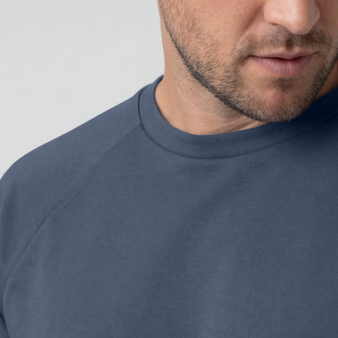 Man in Sandwash Crewneck in Tidal Blue lifestyle shot