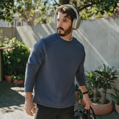 Man wearing the Sandwash Crewneck in Tidal Blue
