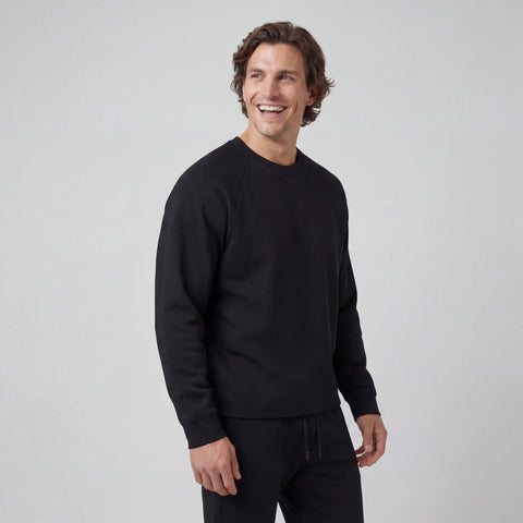A man wearing the Sandwash Crewneck in True Black, front view.