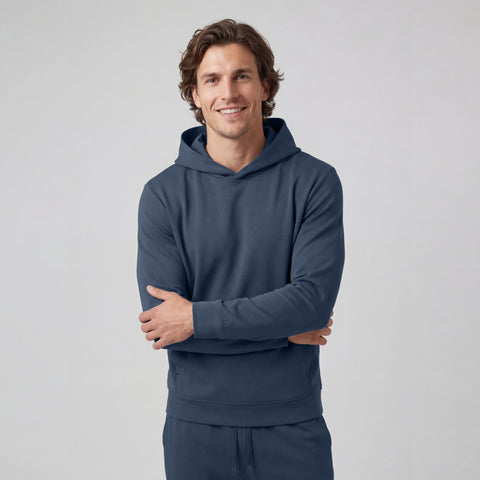 A man wearing the Sandwash Hoodie in Tidal Blue, front view