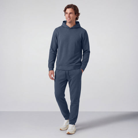 The Sandwash Hoodie Tidal Blue shown from the side on a model