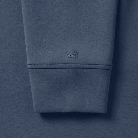 Detail of the Sandwash Hoodie Tidal Blue showing fabric and texture