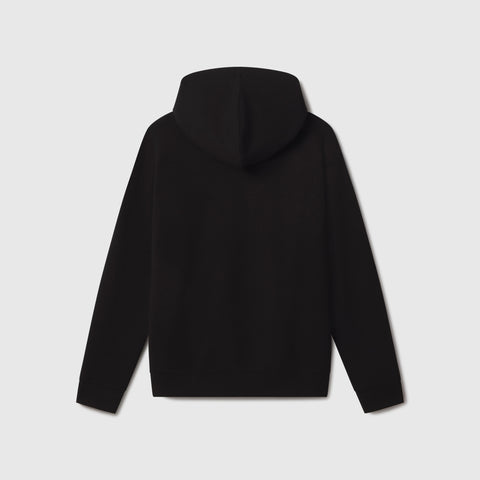 Man in the Sandwash Hoodie True Black in another lifestyle setting