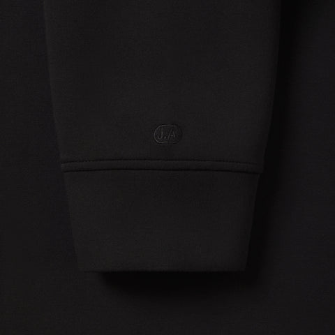 Detail of the Sandwash Hoodie True Black showing fabric and seams