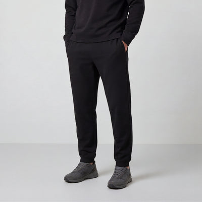 A man wearing the Sandwash Jogger in True Black, front view.