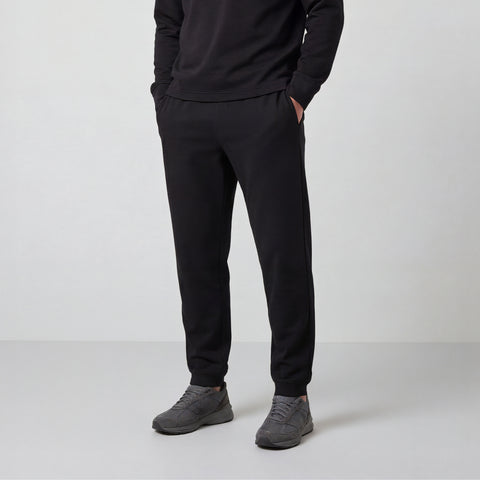 A man wearing the Sandwash Jogger in True Black, front view.