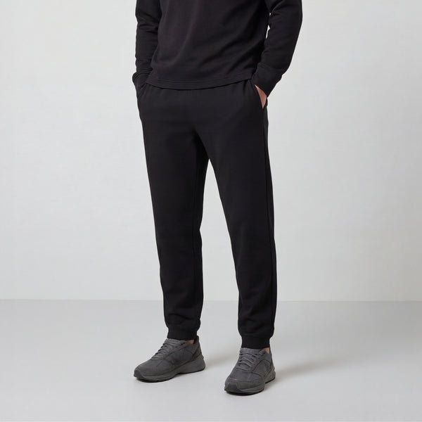 A man wearing the Sandwash Jogger in True Black, front view.