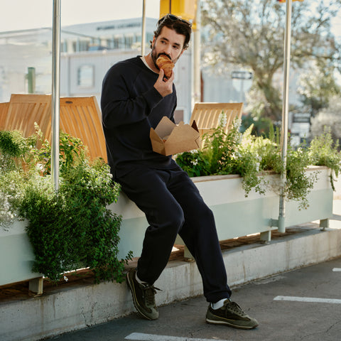The Sandwash Jogger in True Black from The Comfort Kit, laid flat.