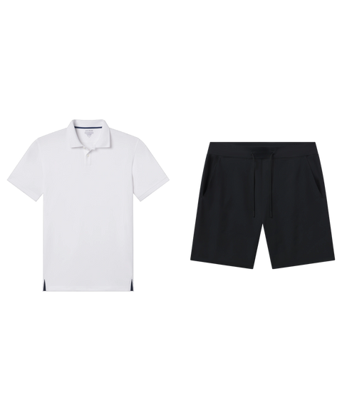 White polo shirt paired with black drawstring shorts.