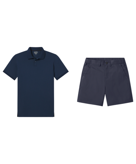 Navy pique polo laid flat beside slate navy shorts.