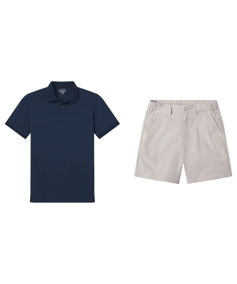 Navy pique polo paired with light stone shorts, shown flat.
