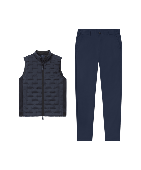 Deep blue quilted Drive vest paired with navy pants, laid flat side by side.