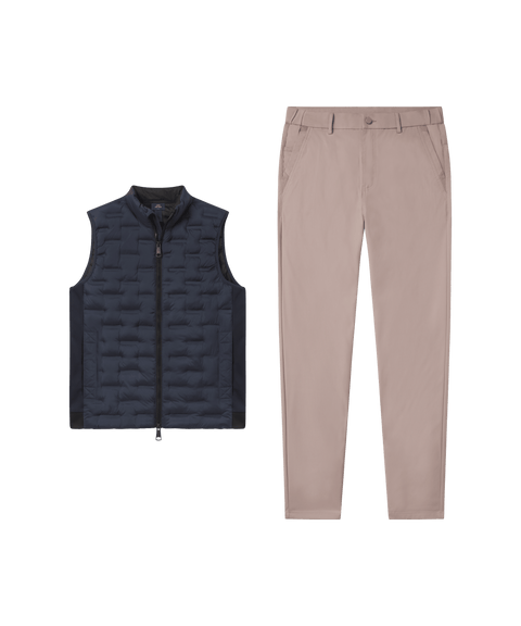 Deep blue quilted Drive vest paired with beige pants, laid flat side by side.