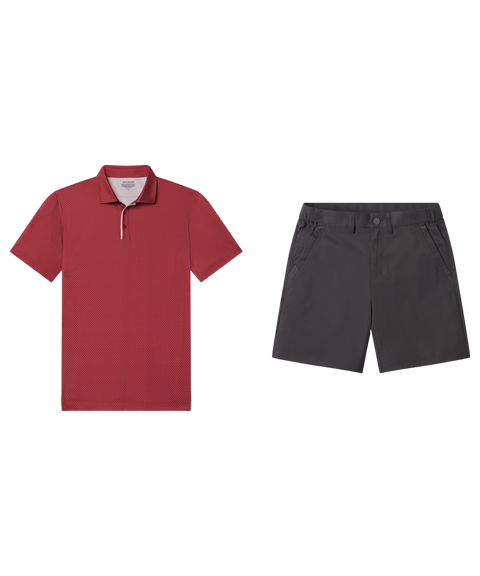 Brick red micro-dot polo paired with charcoal gray shorts, shown flat.