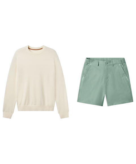 Cream crewneck sweater paired with sage green flat-front shorts, shown flat.