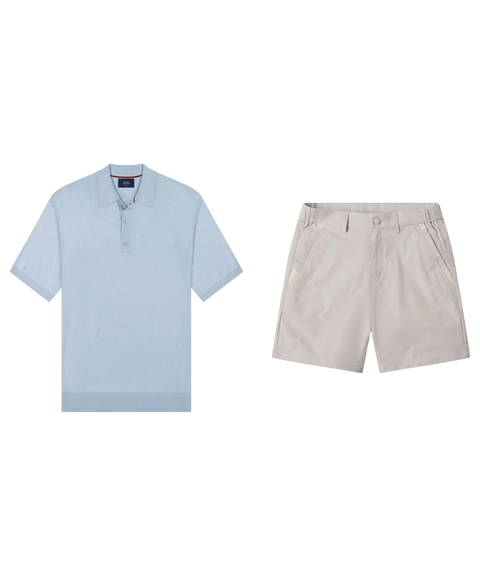 Light blue knit polo paired with stone chino shorts in a flat-lay outfit.
