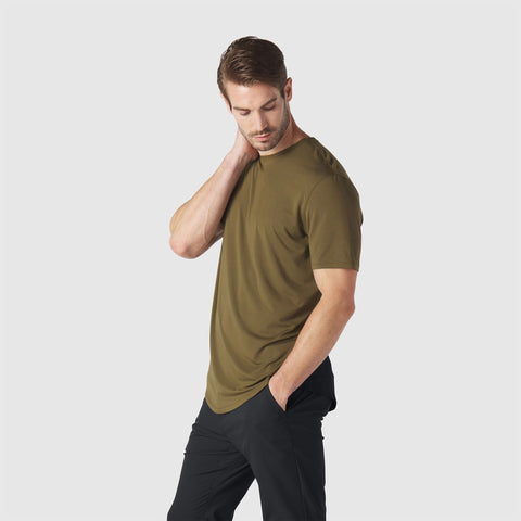 The Anytime Tee in Olive Green displayed in a lifestyle setting