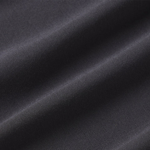The Anytime Tee in Space Black on a neutral background