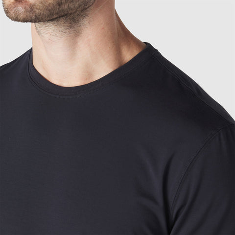 The Anytime Tee in Space Black worn by a model