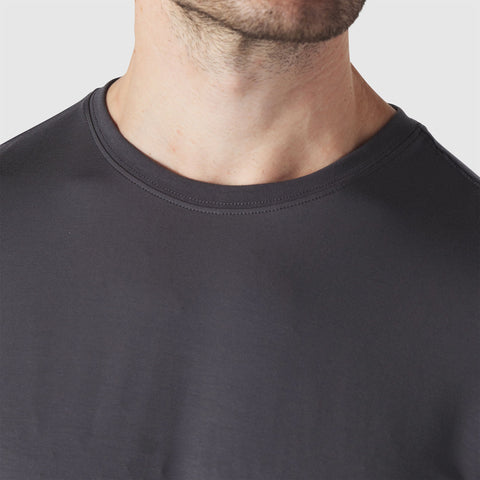 Detail of the Anytime Tee in Charcoal Gray showing fabric texture.