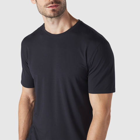 A man wearing the Anytime Tee in Deep Blue.