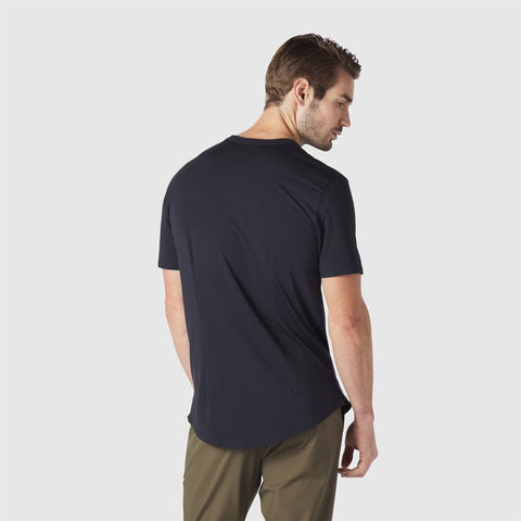 A man in the Anytime Tee in Space Black outdoors